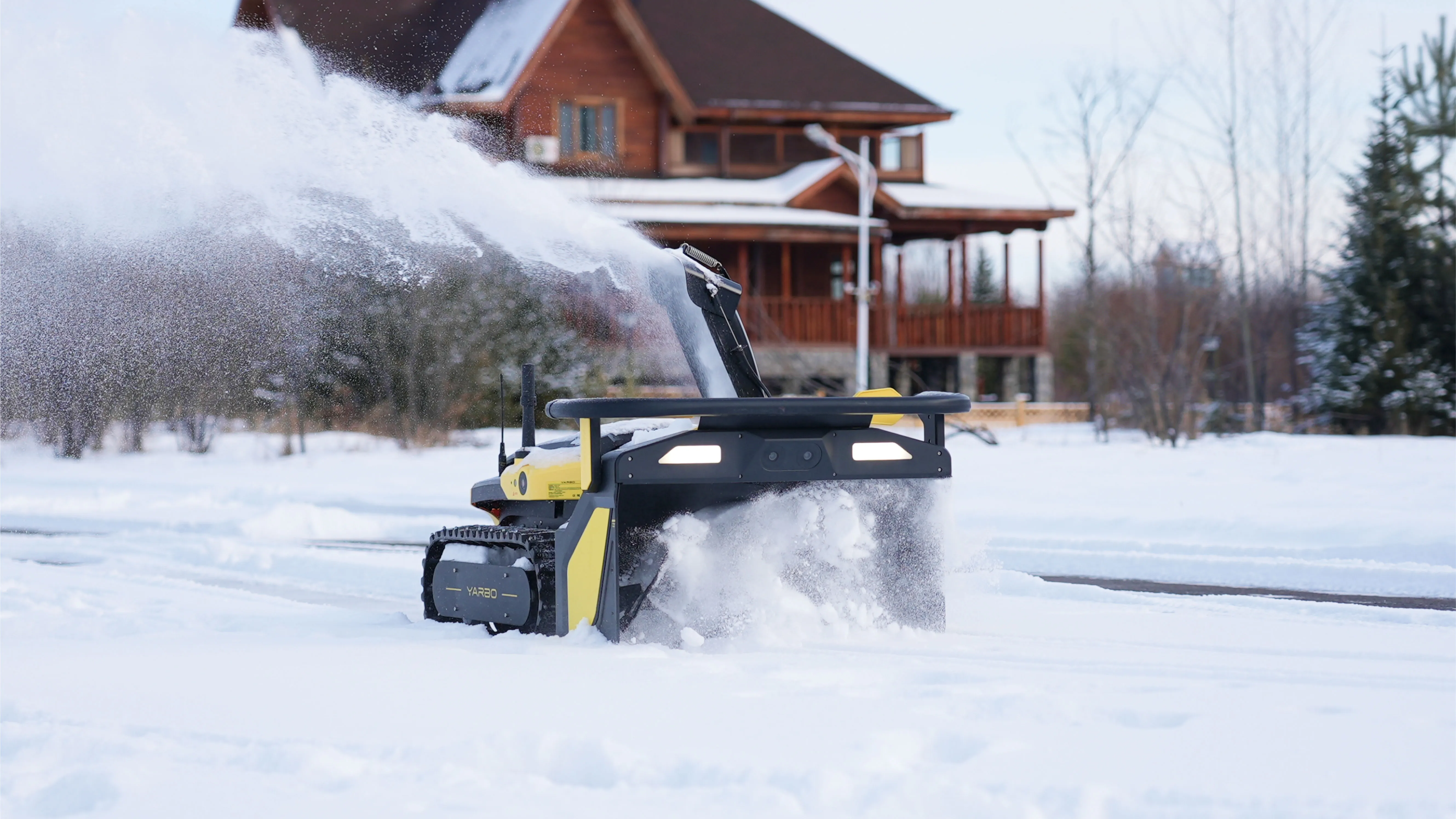 Yarbo Y40 autonomous snow blower robot clearing a snowy driveway